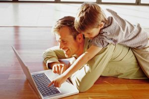 man-and-boy-enjoying-warm-wood-floors